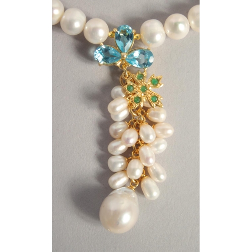 1607 - A PEARL NECKLACE with blue topaz and emerald necklace.