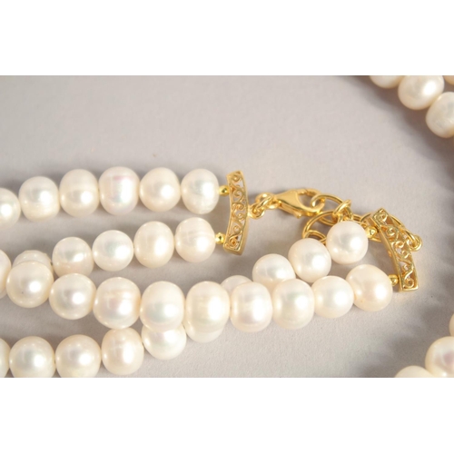 1610 - A PEARL NECKLACE with GOLD PLATED PANTHER CLASP.