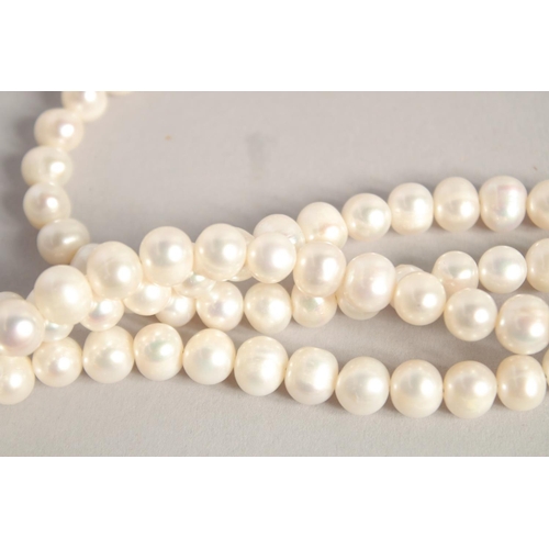 1610 - A PEARL NECKLACE with GOLD PLATED PANTHER CLASP.