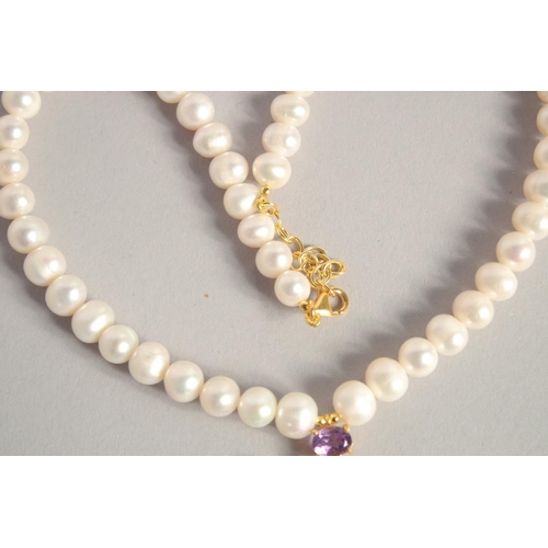 1613 - A PEARL NECKLACE with GOLD PLATED AMETHYST CLASP.