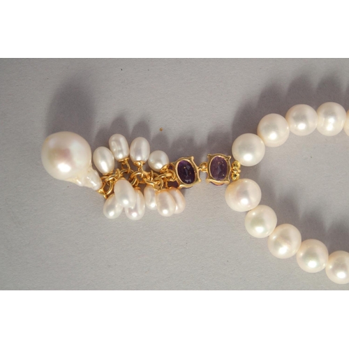 1613 - A PEARL NECKLACE with GOLD PLATED AMETHYST CLASP.