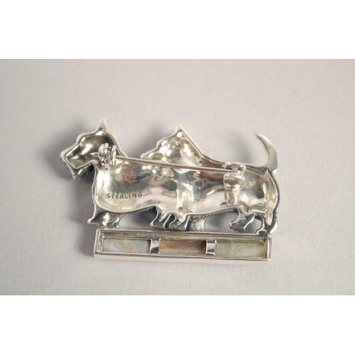 1622 - A SILVER AGATE AND RUBY EYE SCOTTIE DOG BROOCH.