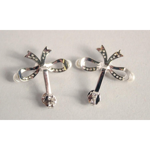 1631 - A PAIR OF SILVER BOW PEARL SET EARRINGS.