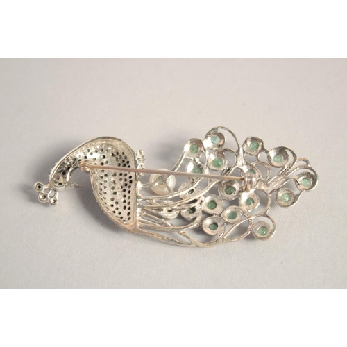 1633 - A SILVER EMERALD MARCASITE AND PEARL PEACOCK BROOCH.