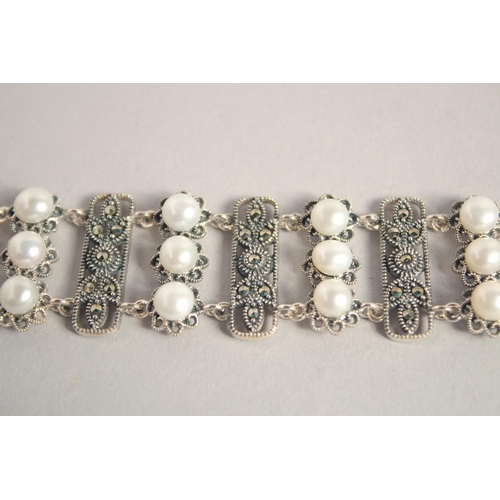 1637 - A SILVER PEARL AND MARCASITE WIDE BRACELET.