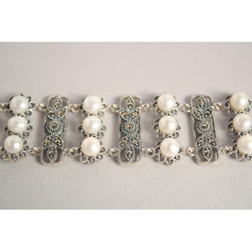 1637 - A SILVER PEARL AND MARCASITE WIDE BRACELET.