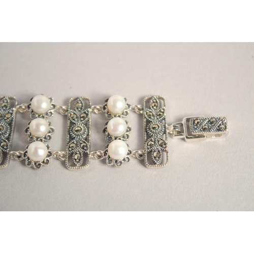 1637 - A SILVER PEARL AND MARCASITE WIDE BRACELET.