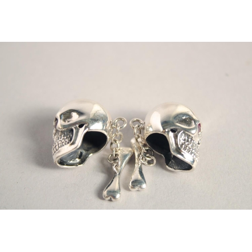 1645 - A PAIR OF SILVER SKULL CUFF LINKS.