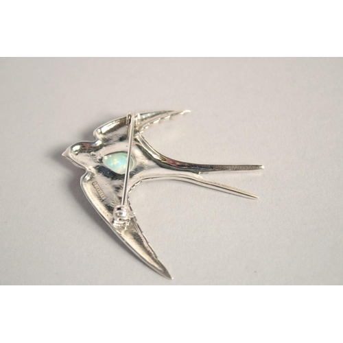 1653 - A SILVER OPAL SET SWALLOW BROOCH.