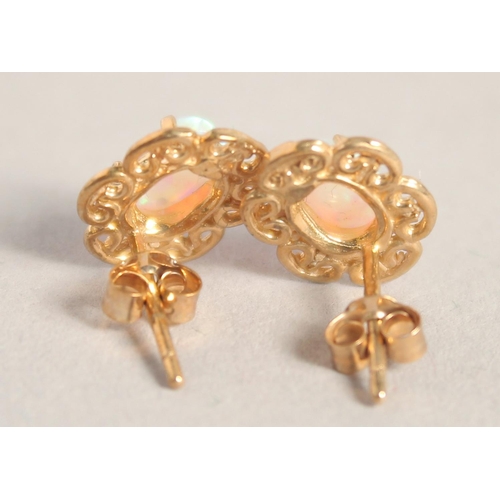 1655 - A PAIR OF SILVER 9CT GOLD OPAL FILIGREE EAR STUDS.