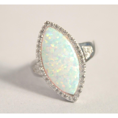 1657 - A SILVER GILSON OPAL RING.