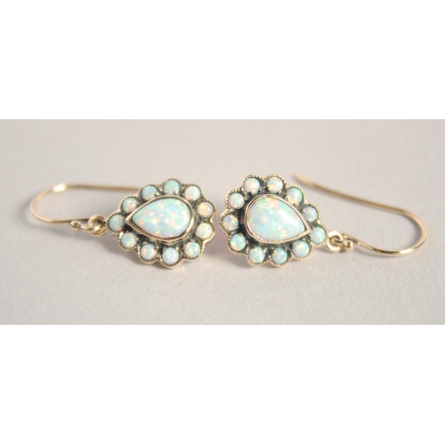 1660 - A PAIR OF 9CT GOLD PEAR SHAPED OPAL EARRINGS.