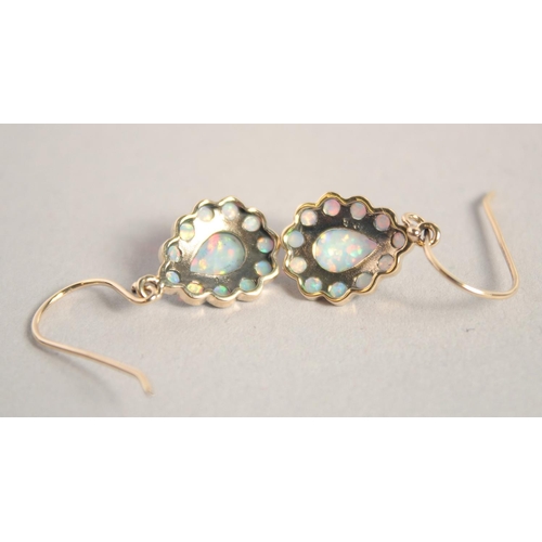 1660 - A PAIR OF 9CT GOLD PEAR SHAPED OPAL EARRINGS.