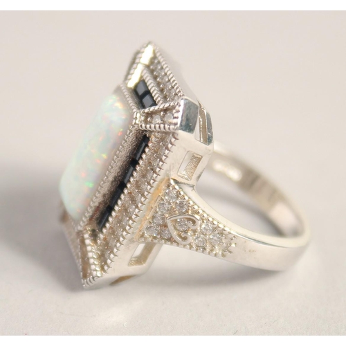 1661 - A SILVER DECO STYLE OPAL RING.