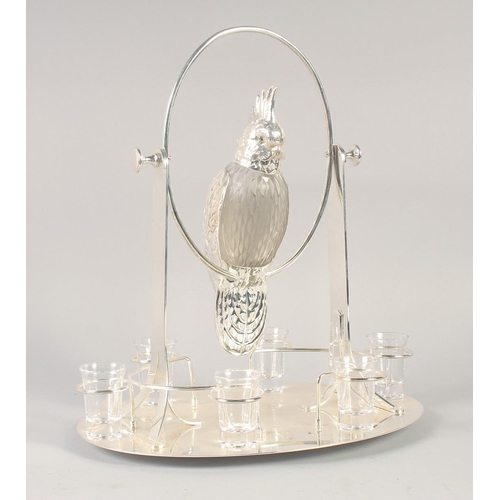 1671 - A GOOD SILVER PLATED AND GLASS LIQUEUR SET as a parrot on an oval base with six glasses. 15ins high.... 