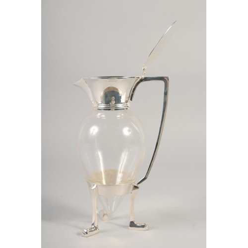 1672 - A CHRISTOPHER DRESSER STYLE SILVER PLATED AND GLASS CLARET JUG with crows feet.