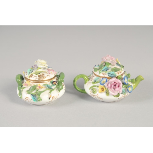 1061 - A 19TH CENTURY ENGLISH PORCELAIN MINIATURE FLORAL ENCRUSTED TEAPOT AND COVER AND A MATCHING SUCRIER ... 