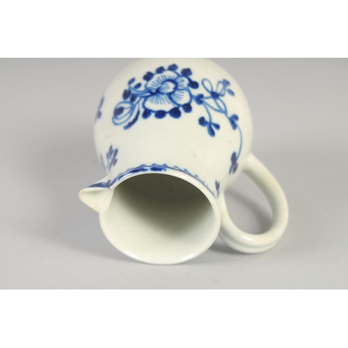 1068 - AN 18TH CENTURY LIVERPOOL JUG painted in underglaze blue with flowers with external line and loop bo... 