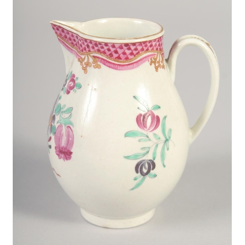 1069 - AN 18TH CENTURY WORCESTER JUG painted with flowers and an internal pink diaper border.