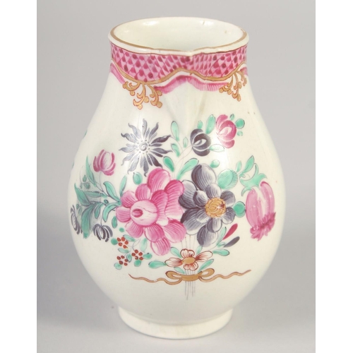 1069 - AN 18TH CENTURY WORCESTER JUG painted with flowers and an internal pink diaper border.