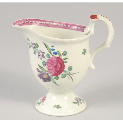 1071 - An 18TH CENTURY LIVERPOOL JUG painted with scattered spray and sprigs of flowers with internal pink ... 