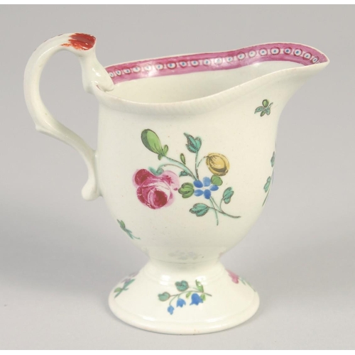 1071 - An 18TH CENTURY LIVERPOOL JUG painted with scattered spray and sprigs of flowers with internal pink ... 