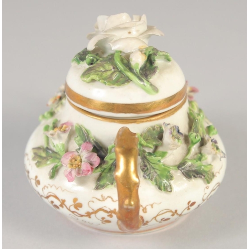 1080 - A 19TH CENTURY ROCKINGHAM MINIATURE TEA POT AND COVER encrusted with flowers, printed griffin mark.