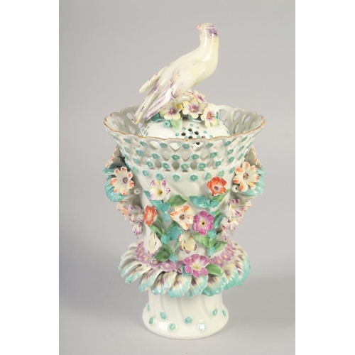 1088 - AN 18TH OR 19TH CENTURY VASE AND COVER with bird finial encrusted with flowers and face-mask handles... 