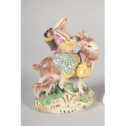 1096 - A 19TH CENTURY STAFFORDSHIRE FIGURE OF THE WELSH TAILOR AND COMPANION together with a later sheep.