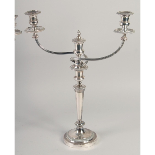 1682 - A GOOD PAIR OF MATTHEW BOLTON SHEFFIELD PLATE THREE LIGHT CANDELABRAS, circular bases, tapering colu... 