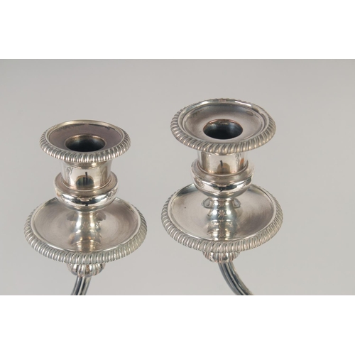 1682 - A GOOD PAIR OF MATTHEW BOLTON SHEFFIELD PLATE THREE LIGHT CANDELABRAS, circular bases, tapering colu... 