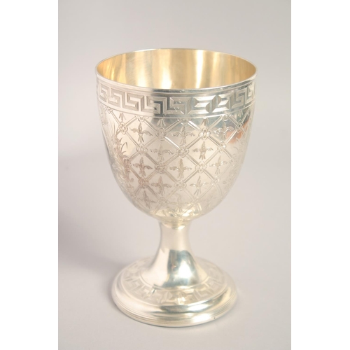 1694 - A GOOD BRIGHT CUT SILVER GOBLET with key pattern, acanthus and other decoration. 7ins high.