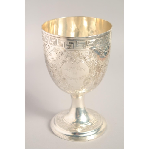 1694 - A GOOD BRIGHT CUT SILVER GOBLET with key pattern, acanthus and other decoration. 7ins high.