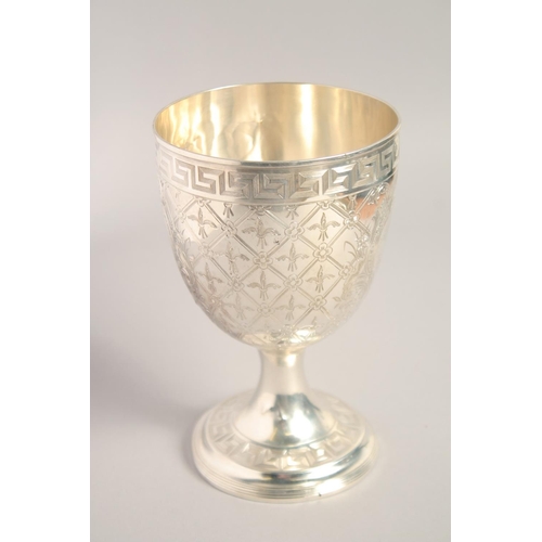 1694 - A GOOD BRIGHT CUT SILVER GOBLET with key pattern, acanthus and other decoration. 7ins high.