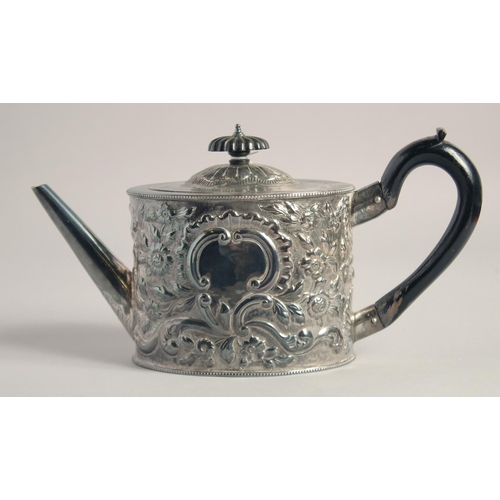 1698 - A GEORGE III OVAL TEA POT AND COVER repousse with flowers and scrolls. London 1784, Intaglio mark. G... 