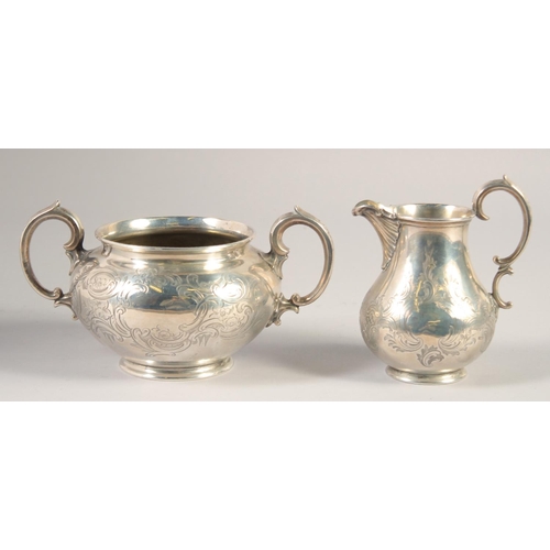 1701 - A VICTORIAN ENGRAVED SILVER TWO HANDLED CIRCULAR SUGAR BOWL AND MILK JUG. London 1848. Maker: Edward... 