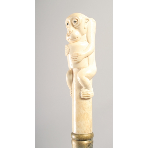 1289 - A WALKING STICK with carved bone handle 