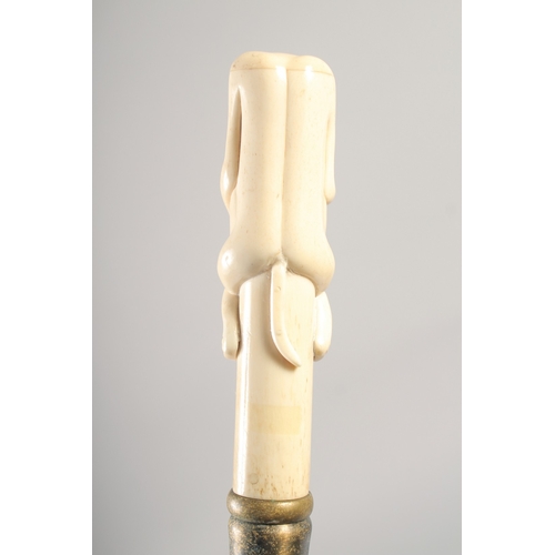 1289 - A WALKING STICK with carved bone handle 