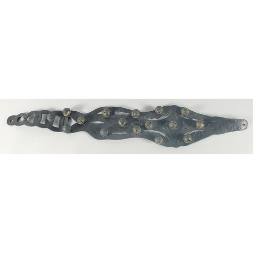 10 - A HORSES LEATHER GIRTH STRAP, with fifteen brass bells, 40cm long.