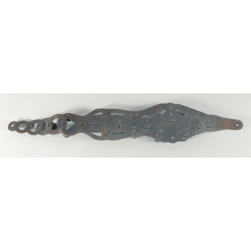 10 - A HORSES LEATHER GIRTH STRAP, with fifteen brass bells, 40cm long.