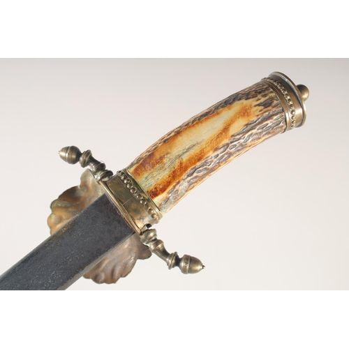 109 - A GERMAN HUNTING HANGER, early 20th century, engraved straight blade, shell guard with acorn quillon... 