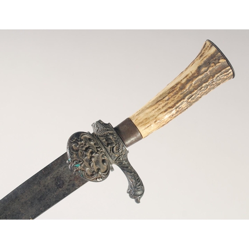 111 - A SHORT EUROPEAN HUNTING SWORD, mid-19th century, straight fullered blade, iron shell guard and quil... 