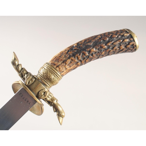 122 - A HUNTING TROUSSEAU, mid-20th century, comprising sword with straight fullered 16in blade, brass she... 