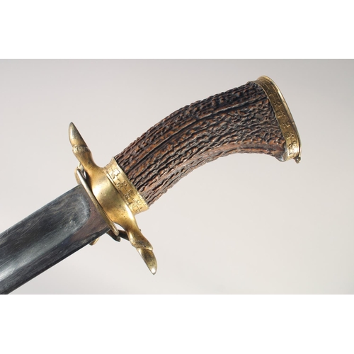 127 - A GERMAN HUNTING SWORD, early 19th century, wide straight fullered blade, hoof quillon & stag's head... 