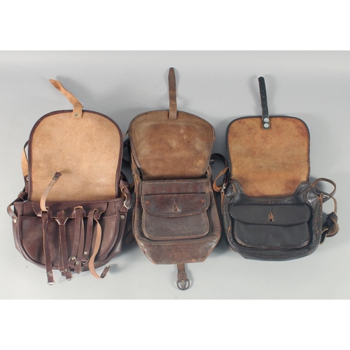 13 - THREE LEATHER HUNTING BAGS.