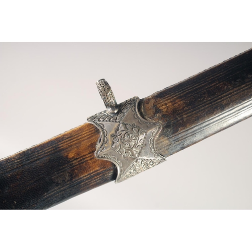 144 - A NORTH AFRICAN NIMCHA, mid-18th century, slightly curved multi fullered blade, downturned quillon w... 