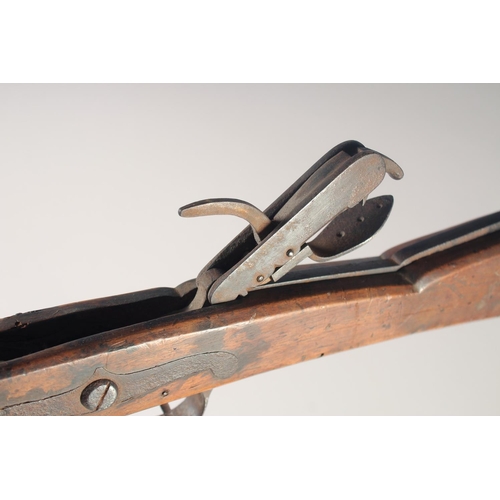 147 - AN ENGLISH STONE BOW, circa 1770, beech stocked with iron mounts, iron bow, folding fore sight, fold... 