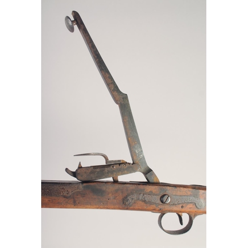 147 - AN ENGLISH STONE BOW, circa 1770, beech stocked with iron mounts, iron bow, folding fore sight, fold... 