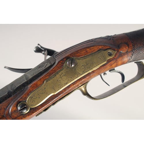 152 - A GERMAN FLINTLOCK SPORTING GUN, dated 1768, 13 bore octagonal 29.5 in barrel, indistinctly signed &... 