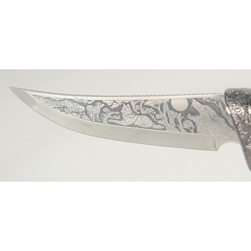 17 - A KNIFE WITH A STAINLESS STEEL BLADE, engraved with a fox and cubs with antler handle carved and pie... 